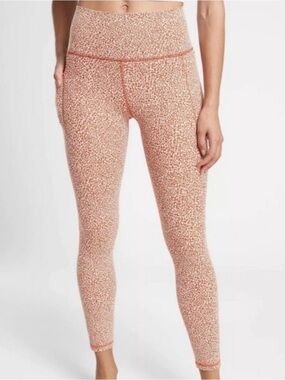 Athleta Salutation Stash II Orange and white micro cheetah print leggings